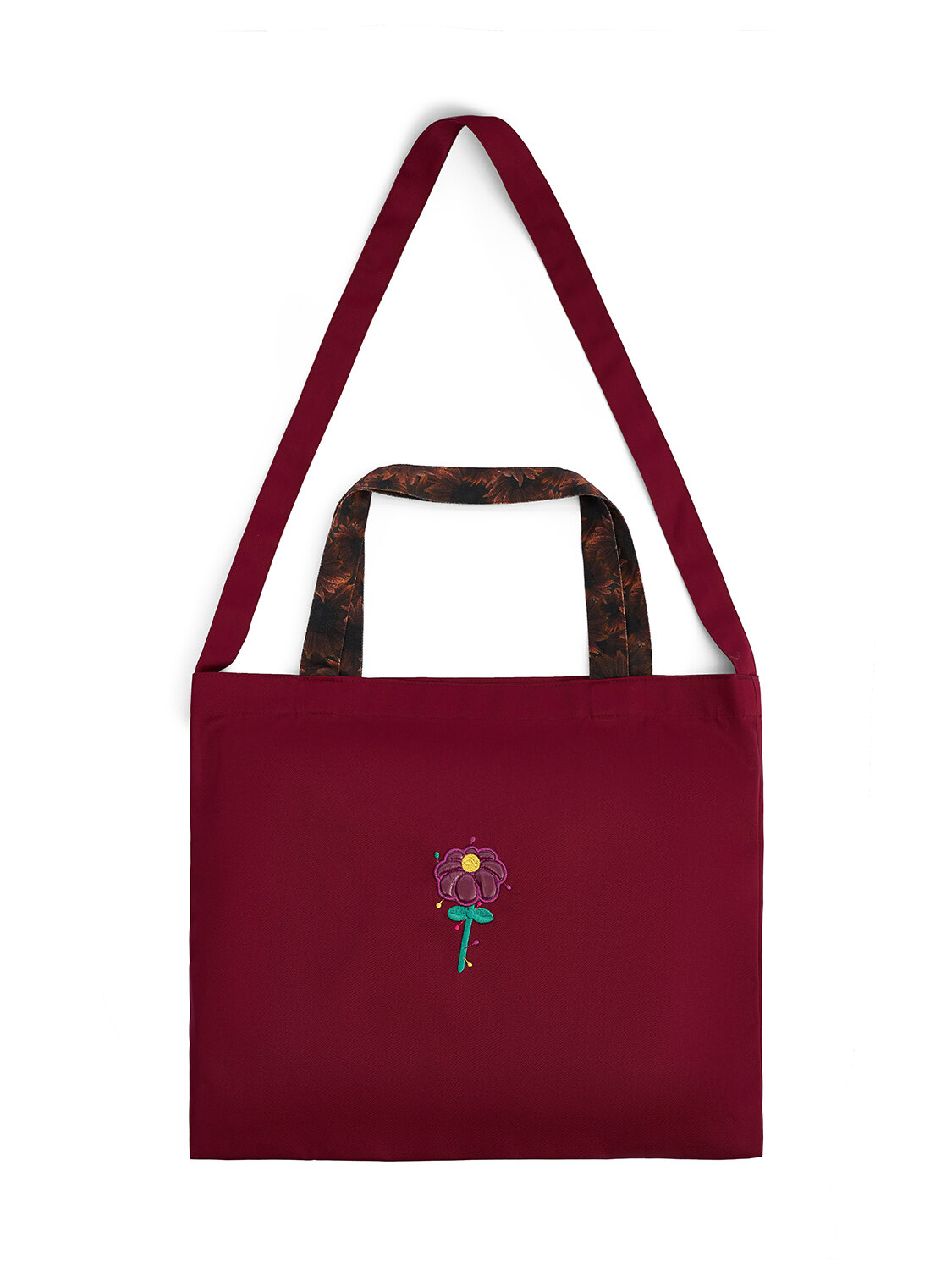 Бордовый шоппер из ткани с принтом цветка и тёмными ручками. Лимитированная коллекция аксессуаров